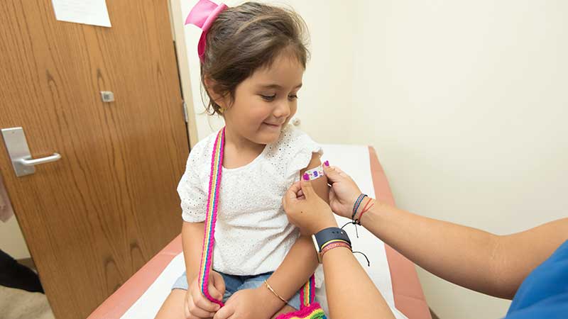 girl getting vaccine