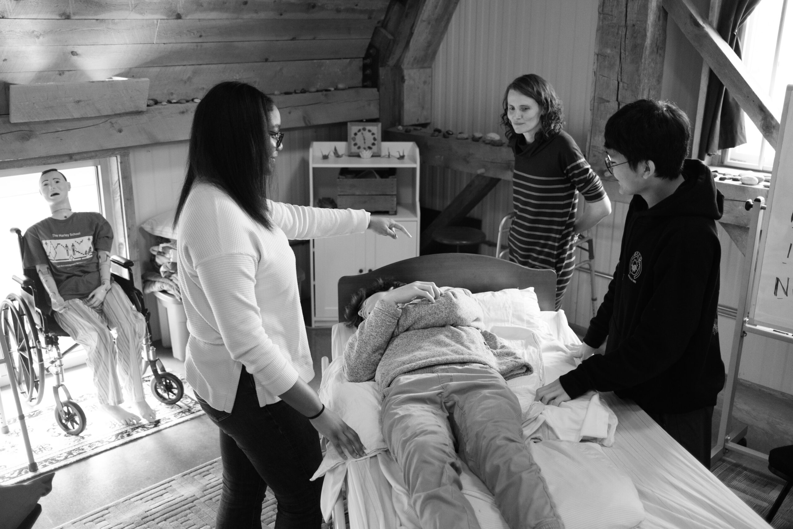 Students in Hospice class practicing care techniques.